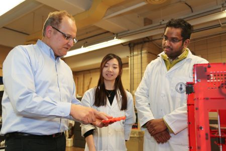 Professor Hani Naguib (MIE, MSE), director of the Toronto Institute for Advanced Manufacturing, discusses research into custom composite materials with mechanical engineering students Ali Anwer and Vina Hui. Canada’s new Innovation Supercluster in Advanced Manufacturing, announced today, includes contributions from Naguib and several other U of T Engineering Professors. (Photo: Kevin Soobrian) 