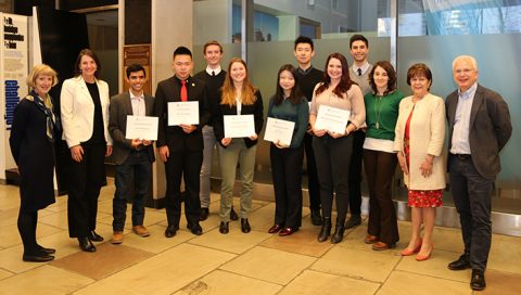 Faculty and members of the Ontario Professional Engineers Foundation for Education celebrate with undergraduate scholarship recipients in the Galbraith Building foyer. (Photo: Jamie Hunter)